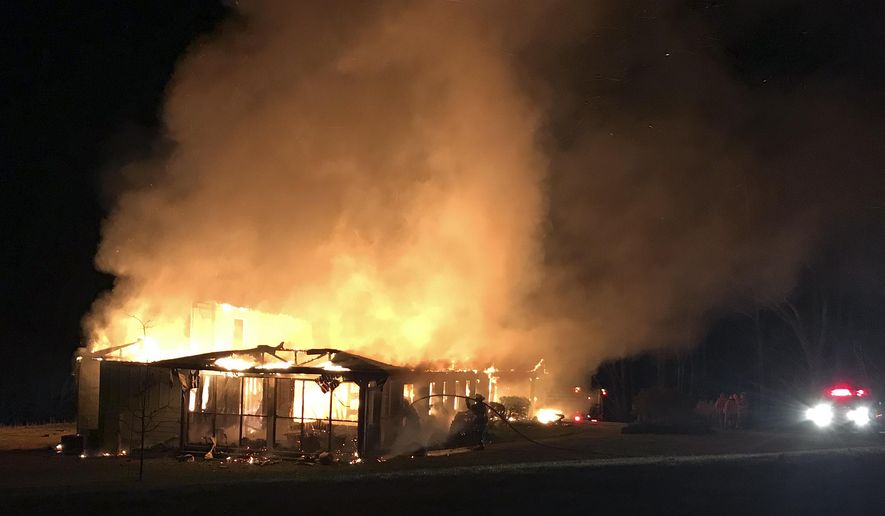 This March 29, 2019 photo provided by the New Market Fire and Rescue Team shows a fire at the main offices of the Highlander Research and Education Center in New Market, Tenn. (Sammy Solomon/New Market Fire and Rescue Team via AP)