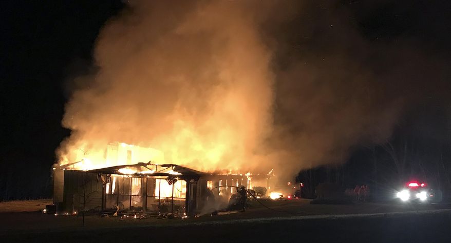 This March 29, 2019 photo provided by the New Market Fire and Rescue Team shows a fire at the main offices of the Highlander Research and Education Center in New Market, Tenn. (Sammy Solomon/New Market Fire and Rescue Team via AP)