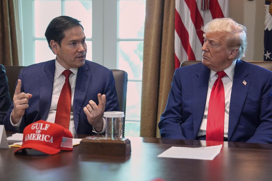 Secretary of State Marco Rubio speaks during a cabinet meeting at the White House, Wednesday, April 30, 2025, in Washington, as President Donald Trump look on. (AP Photo/Evan Vucci)