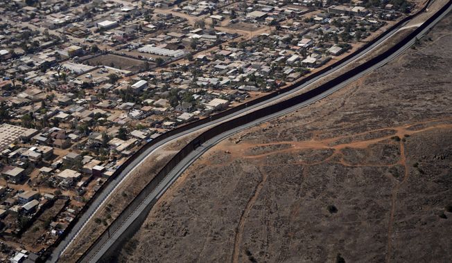 The U.S. Border with Mexico is seen in an aerial view Friday, Jan. 31, 2025, near San Diego. (AP Photo/Jae C. Hong) ** FILE **