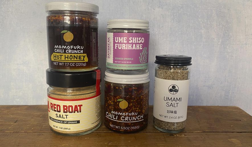 This April 2025 image provided by Katie Workman shows an array of umami-rich condiments. (Katie Workman via AP)