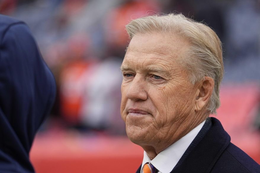 John Elway, Denver Broncos president of football operations, looks on before an NFL football game against the Washington Football Team, Oct. 31, 2021, in Denver. (AP Photo/Jack Dempsey, File)