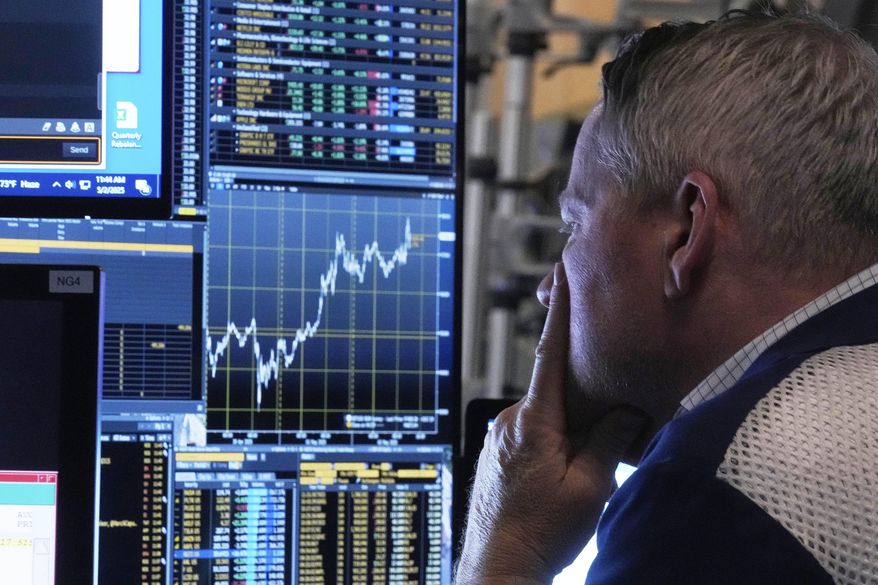 Trader Rob Taylor works on the floor of the New York Stock Exchange, Friday, May 2, 2025. (AP Photo/Richard Drew)