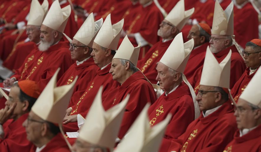 Cardinal Matteo Zuppi, centre, attends a Mass on the third of nine days of mourning for late Pope Francis, in St. Peter's Basilica at the Vatican, Monday, April 28, 2025. (AP Photo/Andrew Medichini)