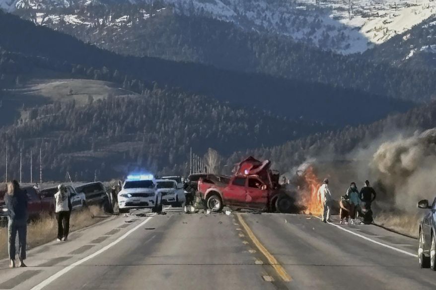 Rescue workers arrive to the scene after a deadly collision between a pickup truck and tour van near Henry’s Lake State Park in eastern Idaho on Thursday, May 1, 2025. (Roger Merrill via AP)