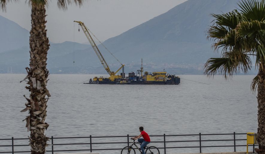 The multi-purpose floating work barge Hebo Lift 2 monitors the stretch of sea off Porticello, near Palermo, Sicily, Italy, Sunday, May 4, 2025, where the British superyacht Bayesian sunk on August 19, 2024 as the operations for its recovery start. (AP Photo/Salvatore Cavalli)