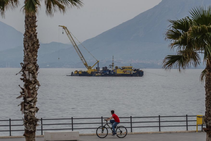 The multi-purpose floating work barge Hebo Lift 2 monitors the stretch of sea off Porticello, near Palermo, Sicily, Italy, Sunday, May 4, 2025, where the British superyacht Bayesian sunk on August 19, 2024 as the operations for its recovery start. (AP Photo/Salvatore Cavalli)