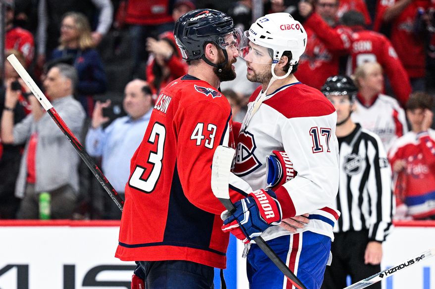 Washington Capitals right wing Tom Wilson (43) chats with Montreal Canadiens right wing Josh Anderson (17) after winning 4-1 in Game 5 at Capital One Arena, Washington, D.C., April 30, 2025. (Photo by Brian Murphy for the Washington Times)