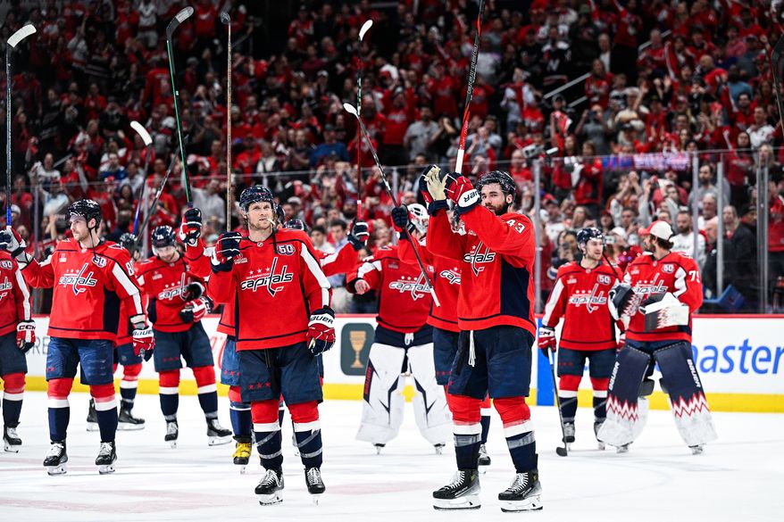 Washington Capitals right wing Tom Wilson (43) and his teammates raise their sticks in honor of Caps fans after eliminating the Montreal Canadiens four games to one at Capital One Arena, Washington, D.C., April 30, 2025. (Photo by Brian Murphy for the Washington Times)