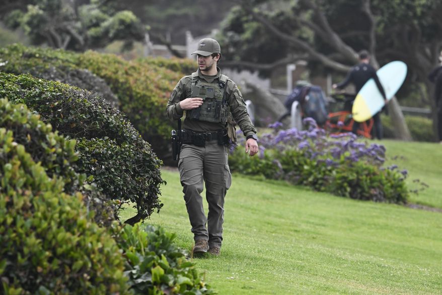 A U.S. Border Patrol agent searches Seagrove Park in Del Mar after a boat capsized Monday, May 5, 2025, at Torrey Pines State beach in San Diego, Calif. (AP Photo/Denis Poroy)