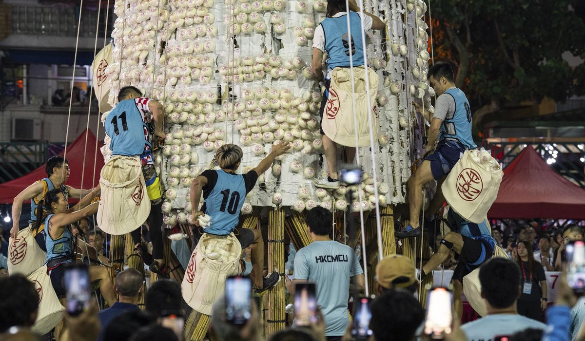 NextImg:Crowds flock to celebrate the century-old Bun Festival in Hong Kong