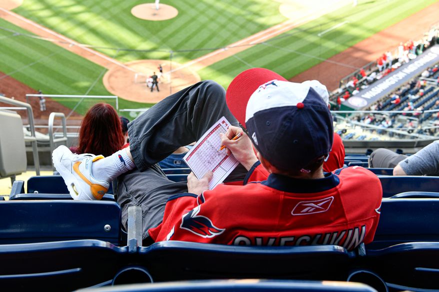 A fan keeping score during the seventh inning of the first game of a doubleheader between the Washington Nationals and the Cleveland Guardians at Nationals Park in Washington D.C., May 6, 2025. (Photo by All-Pro Reels for Washington Times Sports)