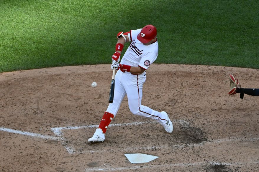 Washington Nationals first baseman Nate Lowe (33) hitting a single during the seventh inning of the first game of a doubleheader against the Cleveland Guardians at Nationals Park in Washington D.C., May 6, 2025. (Photo by All-Pro Reels for Washington Times Sports)