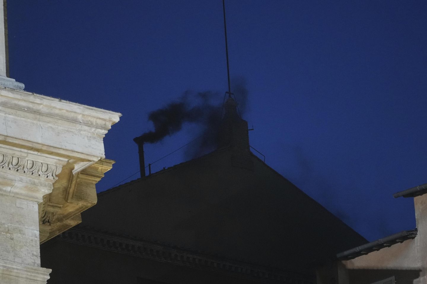 Black smoke pours from Sistine Chapel chimney, indicating conclave hasn't elected pope
