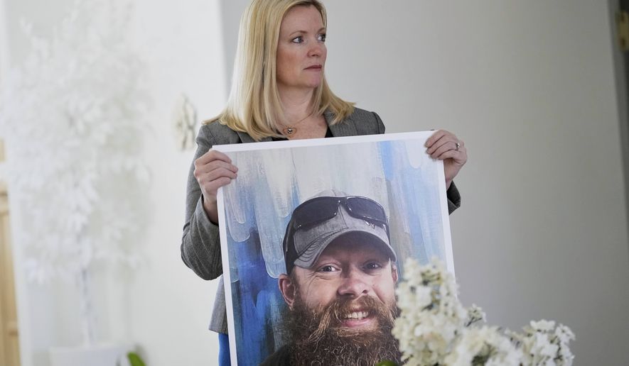 Stacey Wales, sister of the late Christopher Pelkey, displays her brother's image at her mother's home, Wednesday, May 7, 2025, in Chandler, Ariz. (AP Photo/Matt York)