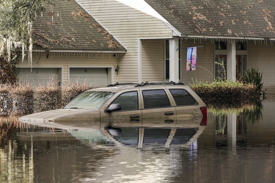 A neighborhood still flooded from Hurricane Milton prepares to have the FEMA Disaster Recover Center covert to a polling location for the general election on Monday, Nov. 4, 2024, in Ridge Manor, Fla. (AP Photo/Mike Carlson, File)