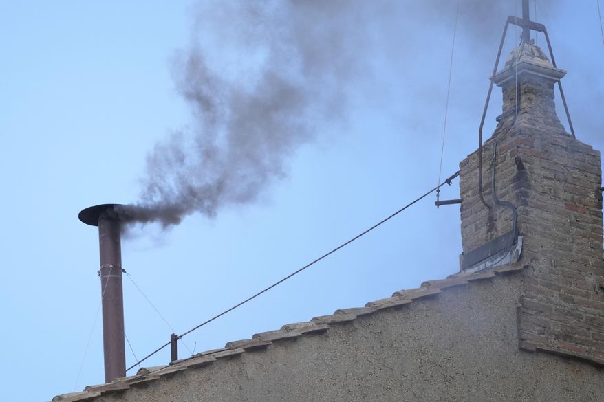 Black smoke billows from the chimney of the Sistine Chapel during the conclave to elect a new pope, at the Vatican, Thursday, May 8, 2025. (AP Photo/Andrew Medichini)
