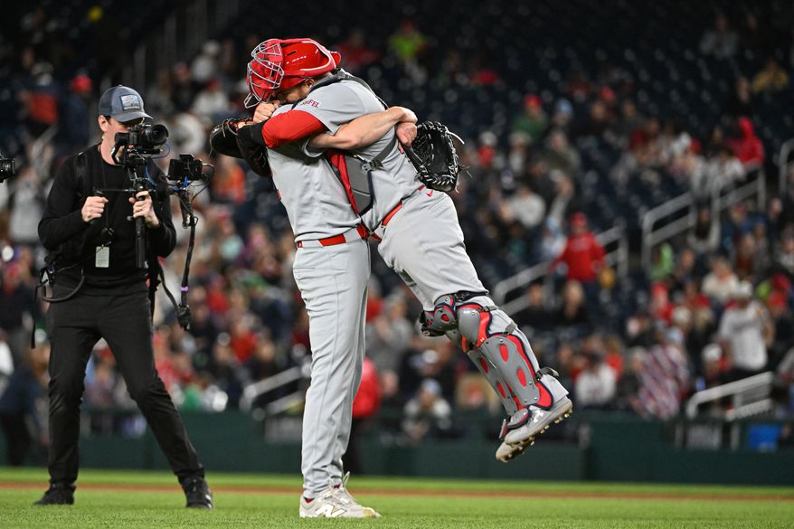 St. Louis Cardinals starting pitcher Erick Fedde (12) getting a hug by catcher Pedro Pages (43) after throwing a complete game, six-hit shutout against the Washington Nationals at Nationals Park in Washington D.C., May 9, 2025. (Photo by All-Pro Reels for Washington Times Sports)