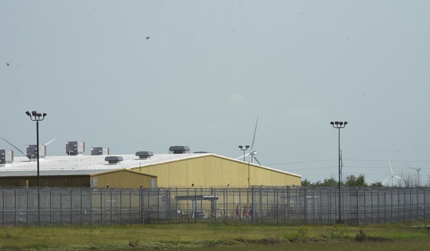 Detainees held at El Valle Detention Center in Raymondville, Texas are seen outside briefly, Thursday, May 1, 2025, after a federal judge in the district barred the Trump administration from deporting any Venezuelans from South Texas under the Alien Enemies Act, an 18th-century wartime law. (AP Photo/Valerie Gonzalez, File)