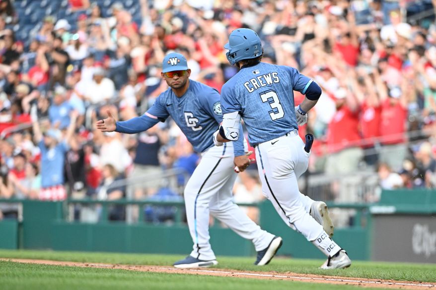 Washington Nationals right fielder Dylan Crews (3) rounding the bases and getting congratulated by first base coach Gerardo Parra (88) after hitting a home run during the eighth inning of an MLB game against the St. Louis Cardinals at Nationals Park in Washington D.C., May 10, 2025. (Photo by All-Pro Reels for Washington Times Sports)