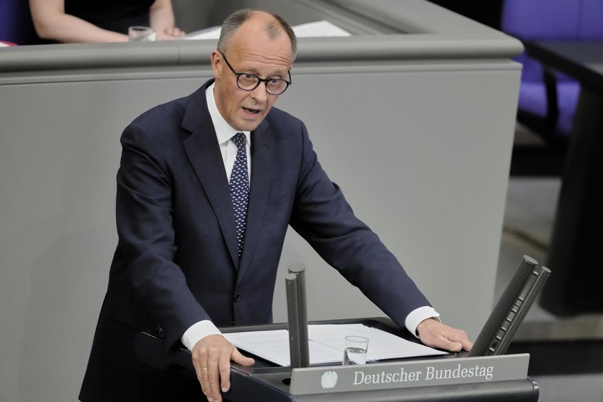 Friedrich Merz delivers his first speech as German Chancellor in the parliament in Berlin, Germany, Wednesday, May 14, 2025. (AP Photo/Markus Schreiber)