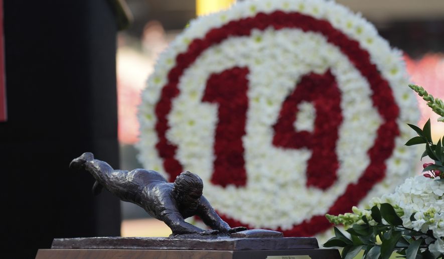 A Pete Rose sculpture is shown during Pete Rose Night events before a baseball game between the Cincinnati Reds and the Chicago White Sox, Wednesday, May 14, 2025, in Cincinnati. (AP Photo/Carolyn Kaster)