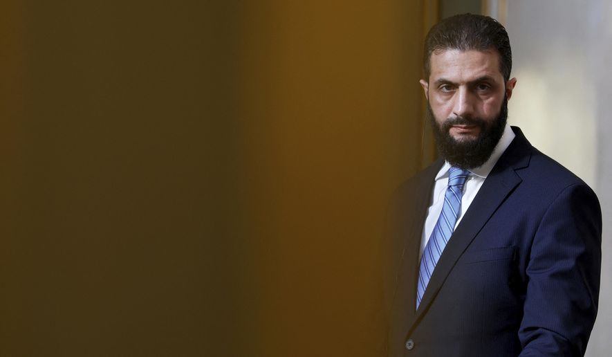 Syria's interim president, Ahmad al-Sharaa, listens during a joint press conference with French President Emmanuel Macron after a meeting at the Elysee Palace in Paris on May 7, 2025. (Stephanie Lecocq/Pool via AP) **FILE**