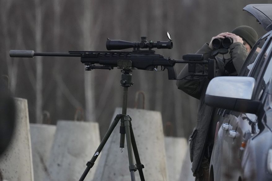 FILE - A Polish soldier at Poland's border with Russia, in Dabrowka, Poland, on Saturday Nov. 30, 2024. (AP Photo/Czarek Sokolowski, File)