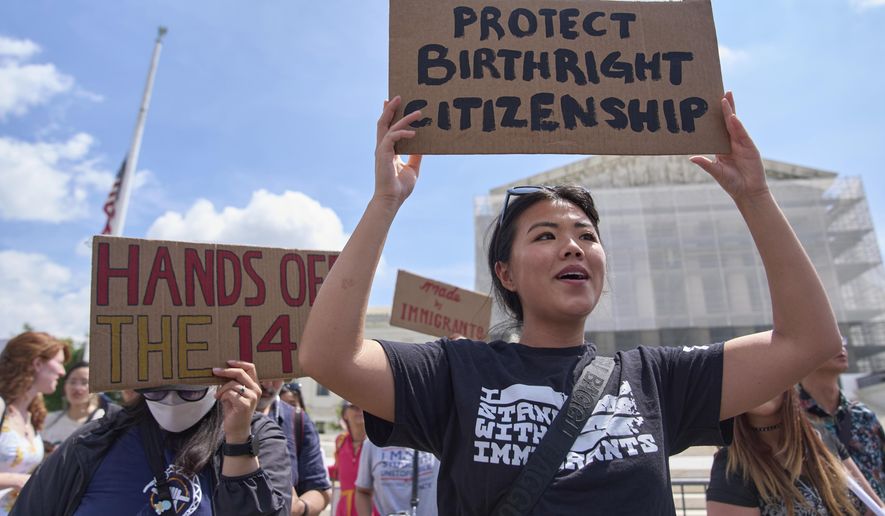 Hannah Liu, 26, of Washington, holds up a sign in support of birthright citizenship, Thursday, May 15, 2025, outside of the Supreme Court in Washington. "This is enshrined in the Constitution. My parents are Chinese immigrants," says Liu. "They came here on temporary visas so I derive my citizenship through birthright." (AP Photo/Jacquelyn Martin)