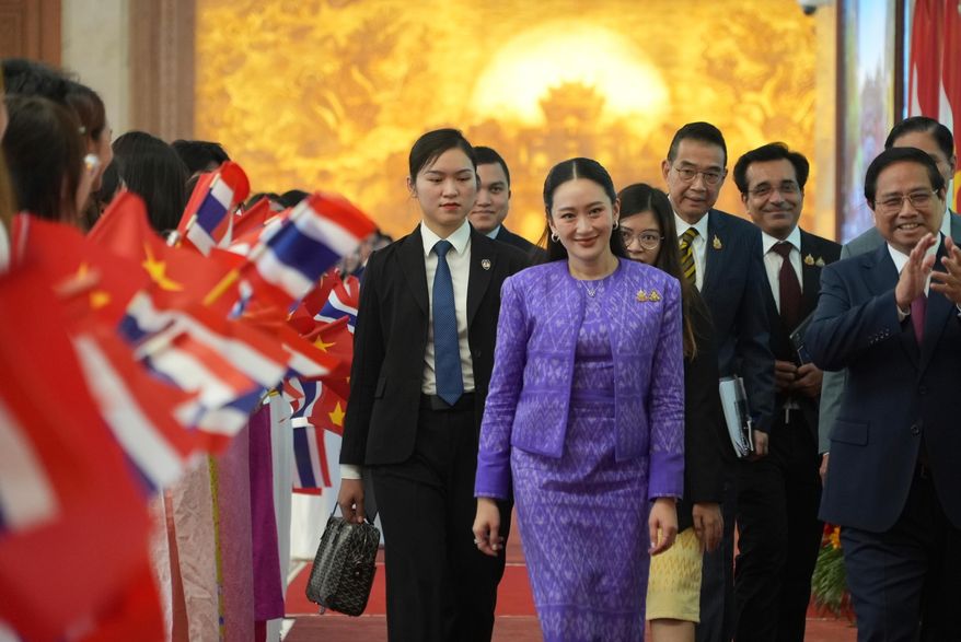 Thai Prime Minister Paetongtarn Shinawatra, front center, walks to a meeting in Hanoi, Vietnam Friday, May 16, 2025. (AP Photo/Hau Dinh)
