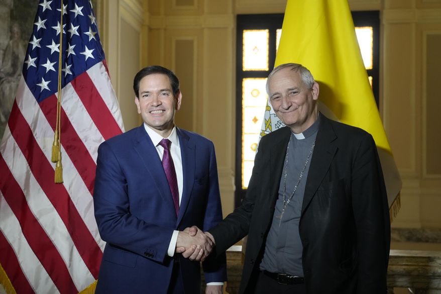 Secretary of State Marco Rubio, left, and President of the Conference of Italian Bishops, Cardinal Matteo Zuppi, pose for a photo at the U.S. Embassy to the Holy See in Rome, Saturday, May 17, 2025. (AP Photo/Gregorio Borgia)