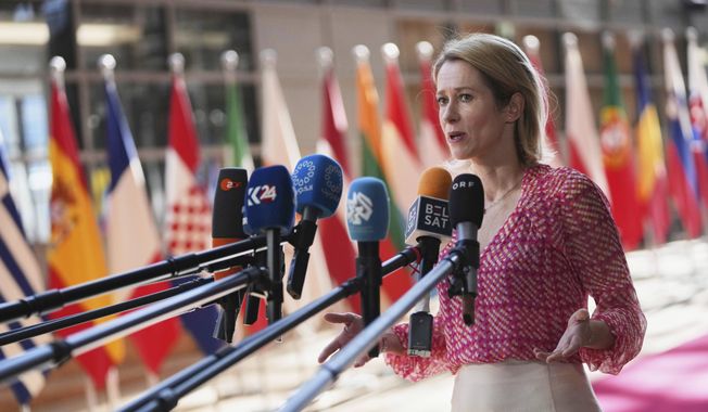 European Union foreign policy chief Kaja Kallas speaks with the media as she arrives for a meeting of EU defense ministers at the European Council building in Brussels, Tuesday, May 20, 2025. (AP Photo/Virginia Mayo)
