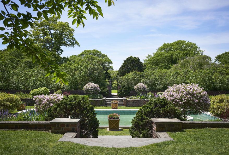 This image provided by Phaidon/Monacelli shows a springtime view of the Blue Pool Garden at Planting Fields State Historic Park in Oyster Bay, N.Y, as published in the book, "Planting Fields: A Place on Long Island," edited by Gina J. Wouters and Jerome E. Singerman. (David Almeida via AP)