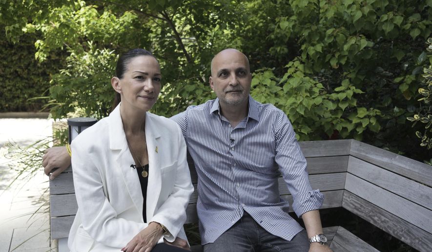 Yael and Adi Alexander, parents of freed Israeli-American hostage Eden Alexander, who was held captive by Hamas militants in the Gaza Strip, pose for a portrait in Tel Aviv, Israel, Monday, May 19, 2025. (AP Photo/Maya Alleruzzo)
