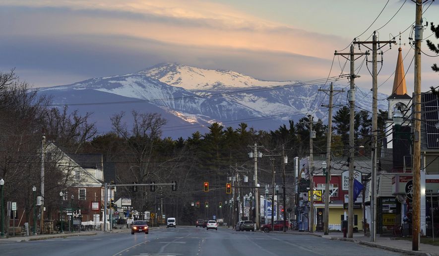 Mount Washington dominates the scene in this view of the business district in the village of North Conway, N.H., Thursday, April 13, 2023. (AP Photo/Robert F. Bukaty) **FILE**