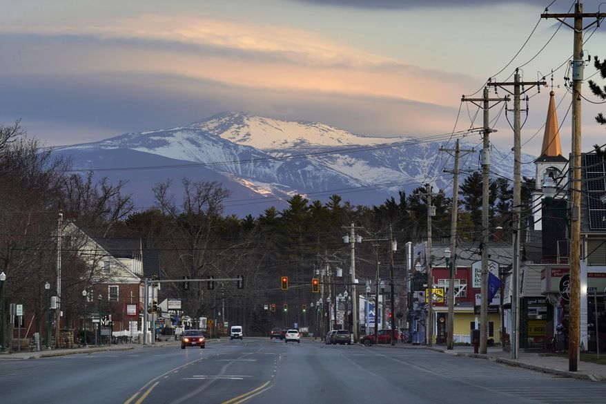 Mount Washington dominates the scene in this view of the business district in the village of North Conway, N.H., Thursday, April 13, 2023. (AP Photo/Robert F. Bukaty) **FILE**