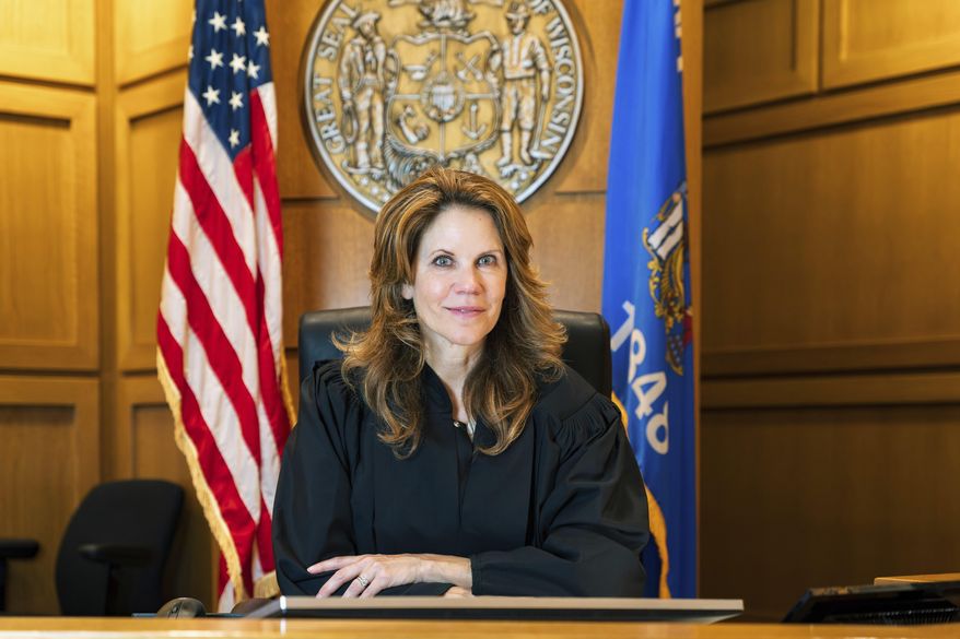 This May 2025 photo provided by the Chris Taylor for Justice campaign shows Wisconsin Appeals Court Judge Chris Taylor inside a courtroom of the Dane County Courthouse in Madison, Wis. (Nicole Merchut/Chris Taylor for Justice via AP)