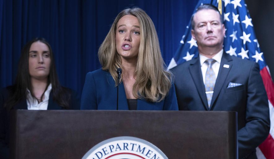 DHS Assistant Secretary for Public Affairs Tricia McLaughlin, flanked by Deputy Director of U.S. Immigration and Customs Enforcement Madison Sheahan, left, and acting Director of U.S. Immigration and Customs Enforcement Todd Lyons, speaks during a news conference at ICE Headquarters in Washington, Wednesday, May 21, 2025. (AP Photo/Jose Luis Magana) ** FILE **