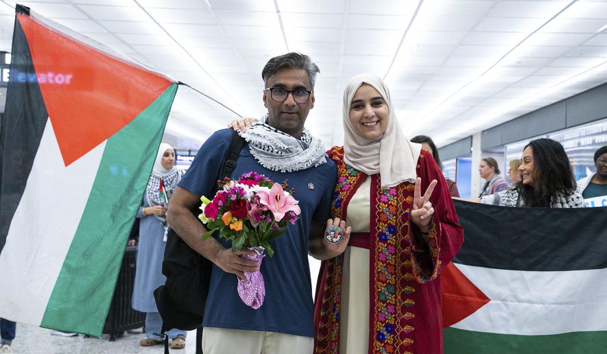 Badar Khan Suri poses for a photo with his wife Maphaze Saleh as he arrives at Dulles International Airport May 14, 2025, in Dulles, Va. (Phuong Tran/ACLU of Virginia via AP) ** FILE **