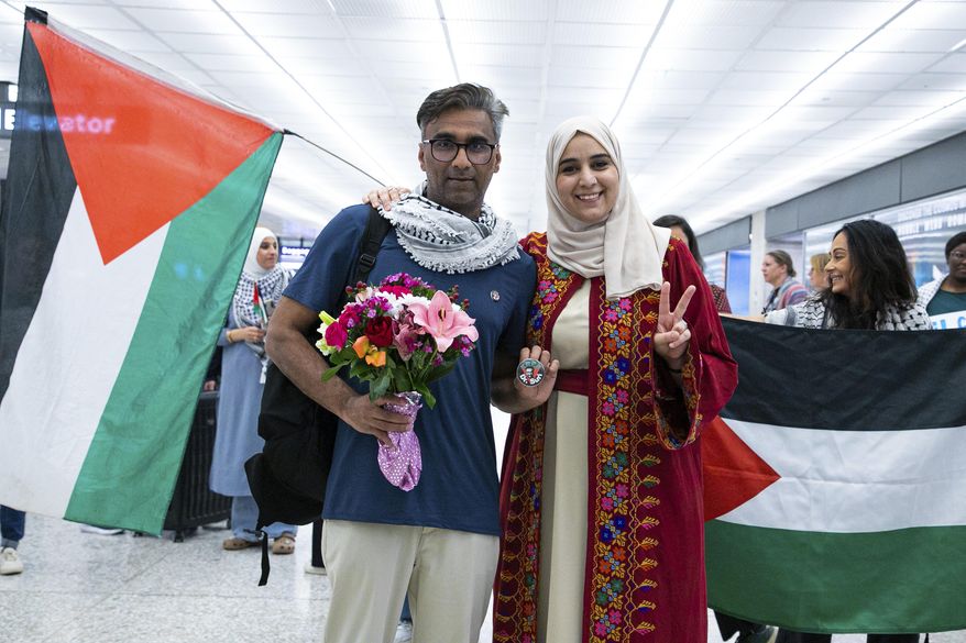 Badar Khan Suri poses for a photo with his wife Maphaze Saleh as he arrives at Dulles International Airport May 14, 2025, in Dulles, Va. (Phuong Tran/ACLU of Virginia via AP) ** FILE **