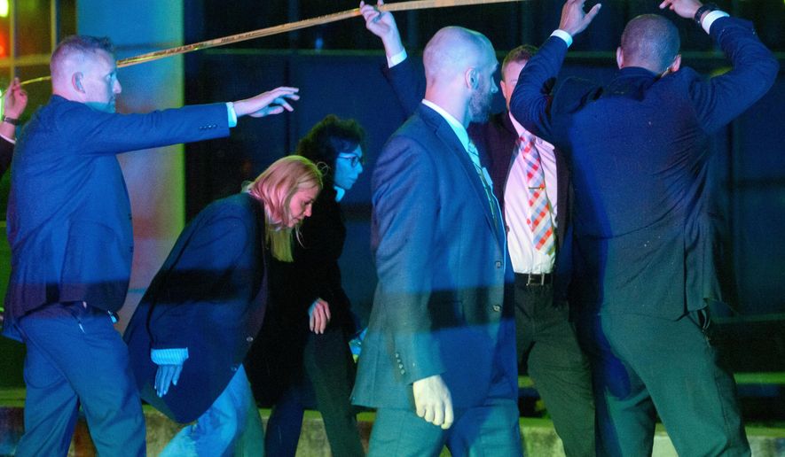 Attorney General Pam Bondi, from second left, and U.S. Attorney for the District of Columbia Jeanine Pirro walk to cars as law enforcement work the scene after two staff members of the Israeli Embassy in Washington were shot and killed outside the Capital Jewish Museum, Thursday, May 22, 2025, in Washington. (AP Photo/Rod Lamkey, Jr.)