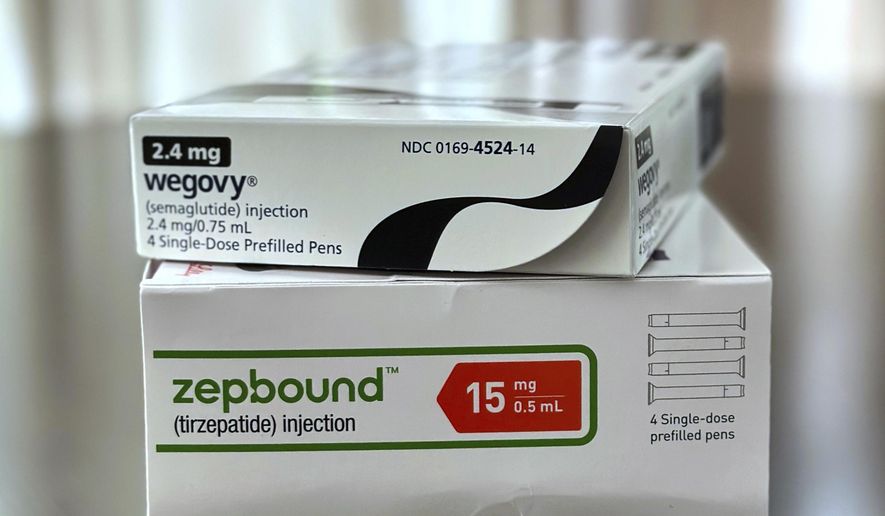 Boxes for the medications Wegovy and Zepbound are arranged for a photograph in California on May 8, 2025. (AP Photo/JoNel Aleccia, File)