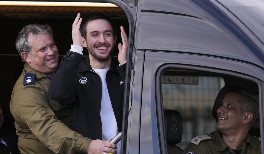 Freed Israeli hostage Omer Shem Tov looks on from a van as he arrives at Beilinson hospital in Petah Tikva, Israel, after he was released from Hamas captivity in the Gaza Strip, Feb. 22, 2025. (AP Photo/Ariel Schalit) **FILE**