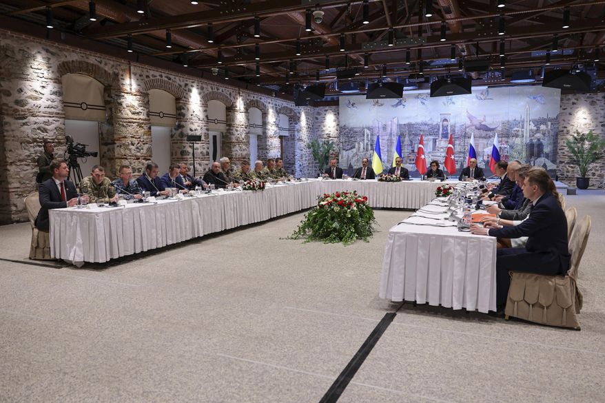 In this handout photo released by Turkish Foreign Ministry, Turkish Foreign Minister Hakan Fidan, center, chairs a meeting between delegations from Russia, right, and Ukraine, left, at Dolmabahce palace in Istanbul, Turkey, Friday, May 16, 2025. (Murat Gok/Turkish Foreign Ministry via AP)