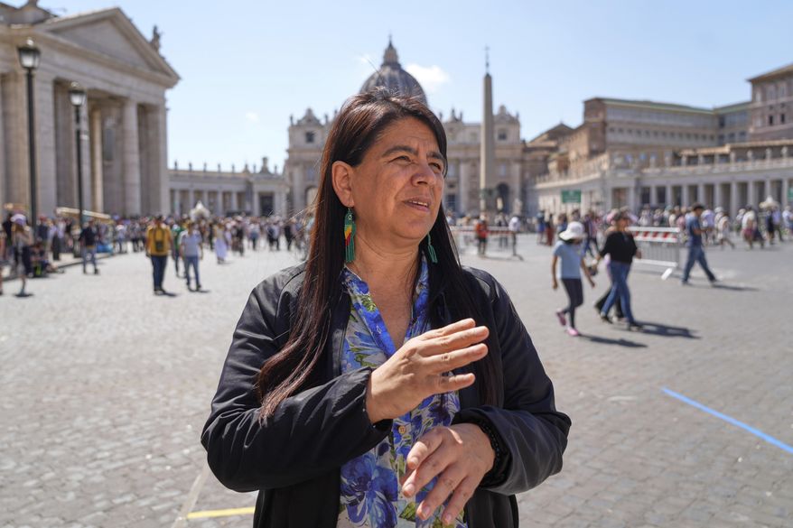 Peruvian investigative journalist Paola Margot Ugaz Cruz talks with the Associated Press near St. Peter's Square at the Vatican, Monday, May 19, 2025. (AP Photo/Gregorio Borgia)