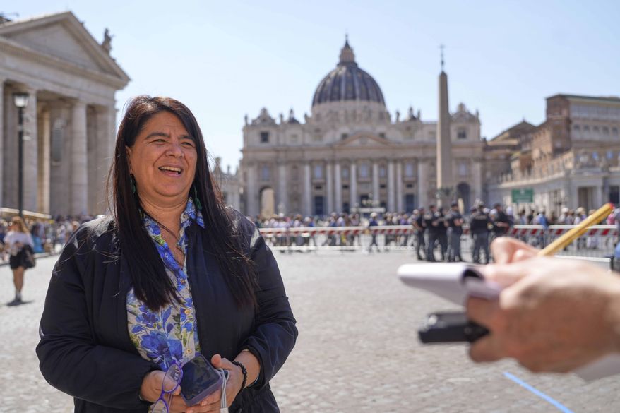 Peruvian investigative journalist Paola Margot Ugaz Cruz talks with the Associated Press near St. Peter's Square at the Vatican, Monday, May 19, 2025. (AP Photo/Gregorio Borgia)