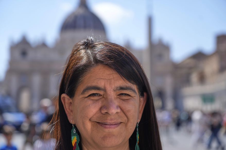 Peruvian investigative journalist Paola Margot Ugaz Cruz talks with the Associated Press near St. Peter's Square at the Vatican, Monday, May 19, 2025. (AP Photo/Gregorio Borgia)