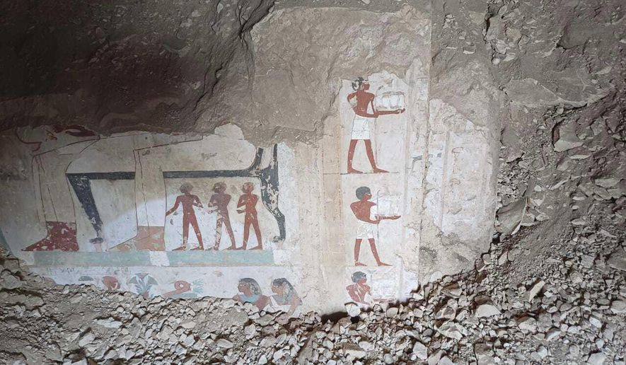 In this undated photo, hieroglyphs are revealed in the three new graves of senior statesmen found in the Dra' Abu al-Naga necropolis area in Luxor, Egypt. (Egypt Ministry of Tourism and Antiquities via AP)