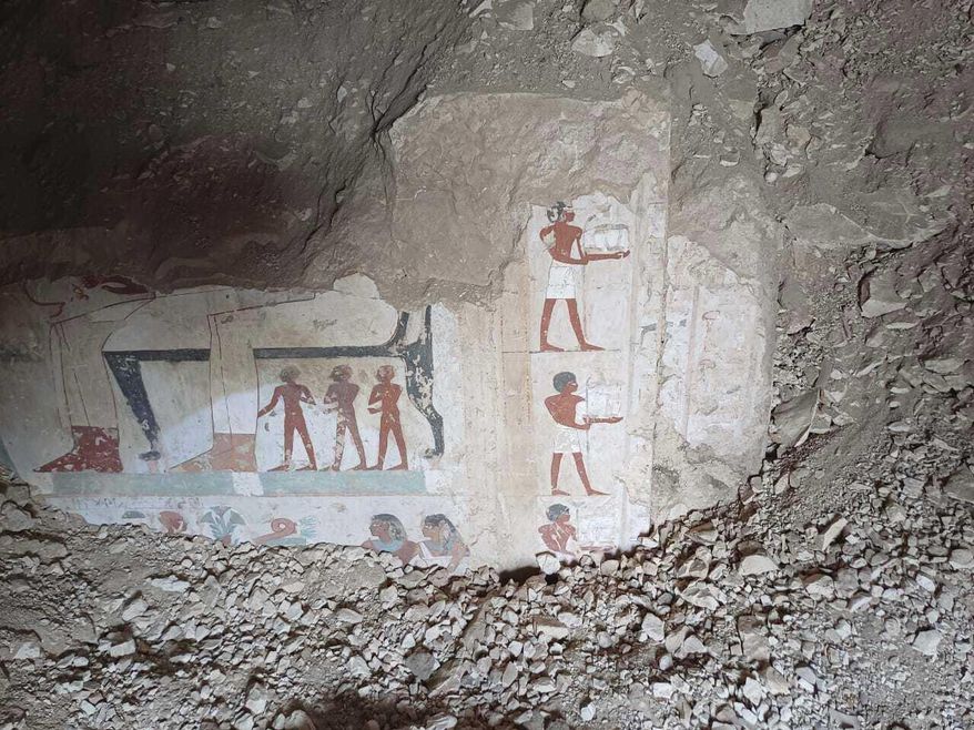 In this undated photo, hieroglyphs are revealed in the three new graves of senior statesmen found in the Dra' Abu al-Naga necropolis area in Luxor, Egypt. (Egypt Ministry of Tourism and Antiquities via AP)