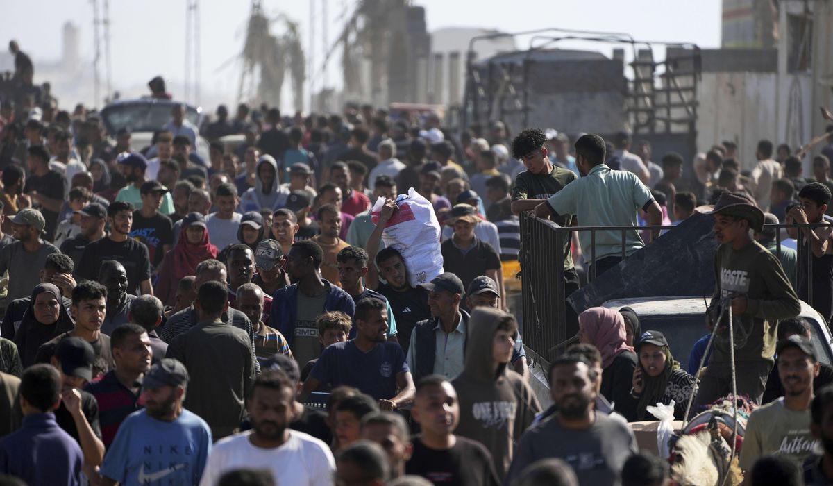 NextImg:Israeli gunfire heard as crowds of Palestinians try to reach an aid center in Gaza